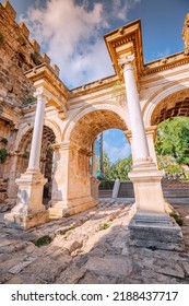 Vertical Dramatic View Of Famous Gate Or Hadrianus Arch In Antalya Without Visitors. Travel Landmarks And Must-see Tourist And Sightseeing Sites In Turkey