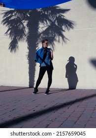 A Vertical Elegant Photo Of A Young Spanish Female In An Urban Fashion Shoot