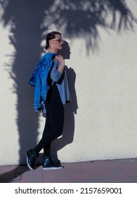 A Vertical Elegant Shot Of A Young Female In An Urban Fashion Shoot