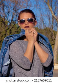 A Vertical Elegant Shot Of A Young Spanish Woman In An Urban Fashion Shoot