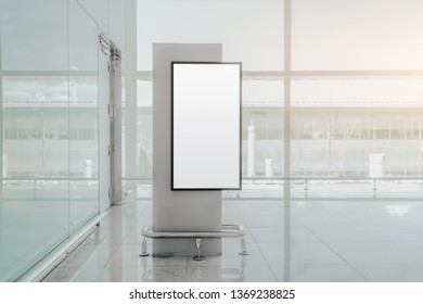 A Vertical Empty Banner Mockup Indoors Of An Airport Terminal; Blank Information Poster Placeholder Template Near A Window Of A Mall; An Indoor White Billboard Mock-up Inside A Railway Station Depot