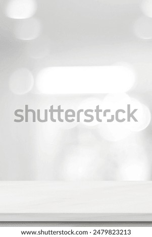 Vertical empty white table top, counter, desk over blur perspective store with bokeh light background, White marble stone table, shelf and blurred shop for food, product display mockup