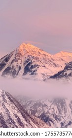 Vertical Frame Snowy Wasatch Mountains With Sharp Peaks Illuminated By Sunset In Winter