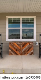 Vertical Frame Two Rocking Chairs On A Covered Patio