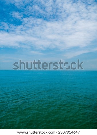 Vertical front view landscape Blue sea and sky blue background morning day look calm summer Nature tropical sea Beautiful  ocen water travel Bangsaen Beach East thailand Chonburi Exotic horizon.
