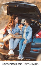 Vertical Full Body Family Portrait Of Older Sister Sits With Her Teen Brother Have Fun In The Car And Eat Pizza Together