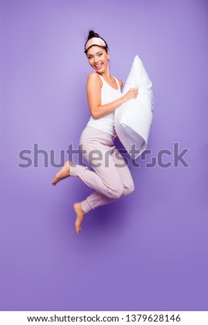 Vertical full length side profile body size photo beautiful she her lady jump hold arms hands pillow naked nude feet foot satisfied wear sleeping mask pants tank-top isolated violet purple background