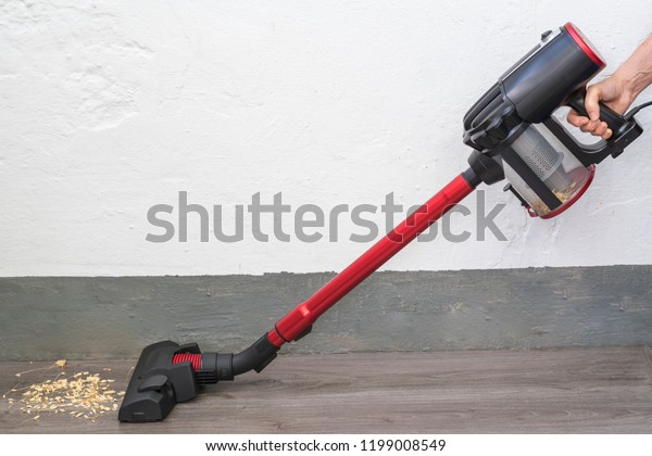 Vertical Hand Vacuum Sucks Dirt Out Royalty Free Stock Image