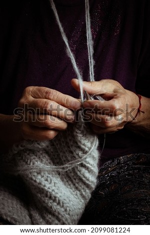vertical hands knitting close up 