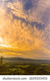 Vertical Horizon Sunset mountain range beautiful landscape mist foggy sunrise beam. Golden sky Mountain landscape mountain. Vertical Amazing Landscape cloud sky on sunrise. Gold sunlight heaven scene