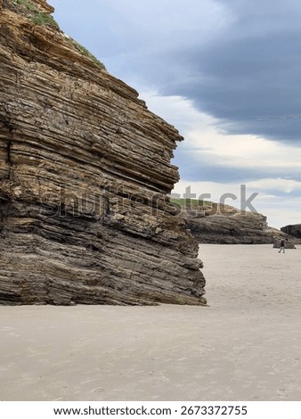 Vertical and horizontal layered rock cliffs in Playa de las Catedrales, Spain.