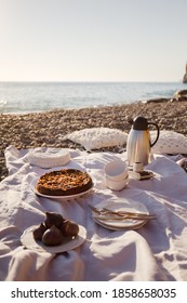 Vertical Image Of Beach Picnic With Cake, Tea And Figs. Negative Space.