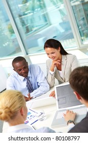 Vertical Image Of Business Team Working At Meeting