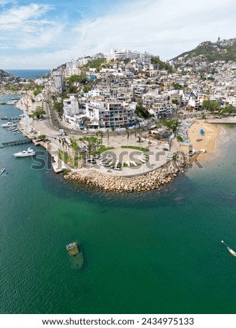Vertical image capturing the iconic Roundabout of Illustrious Men in Acapulco, seen from an aerial vantage point