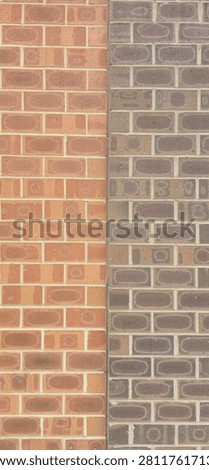 Vertical Image Of A Close Up Front Facing View Of Two Different Colored Brick Masonry Walls Placed Directly Beside Each Other With Patches Of Unique Firing Patterns Made In Bricks