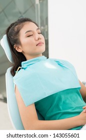 Vertical Image Of A Napping Patient In The Stomatological Chair