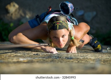 Vertical image of woman doing exercise on the mountain