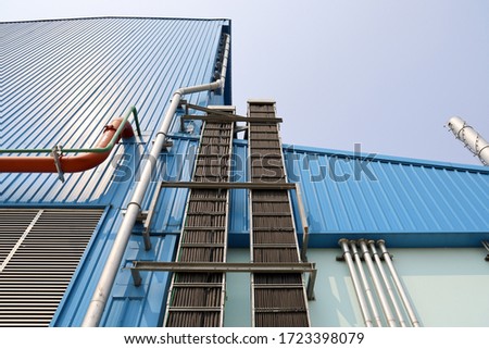 Vertical installation of cable ladder and rainspout of building