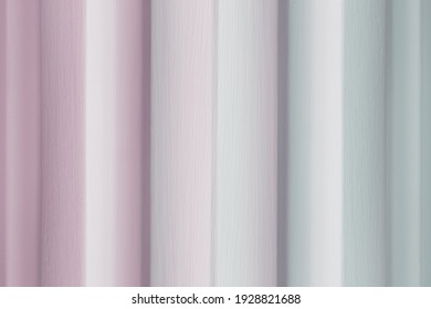 Vertical lines in a repeating pattern; background texture or design of striped lines