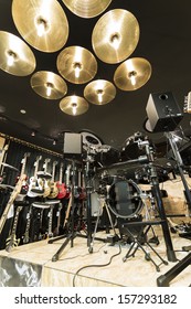 A Vertical Low Angle Shot Of A Drum Set In A Musical Instrument Store