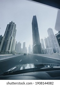 A vertical low angle shot of skyscraper captured during the daytime