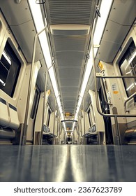 A vertical low-angle shot of the empty train interior of Milan Metro. Italy.