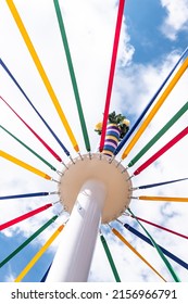 A vertical low-angle view of the Maypole during the folk dance festival