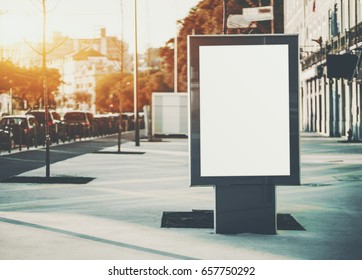 Vertical mock-up of city poster with thick edges, blank white billboard in urban settings, empty street information placeholder on sidewalk with copy space for logo, advertising or your messages