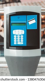 A Vertical Modern Electronic Desk With An Intercom For Card Payment; An Outdoor Parking Payment Terminal With Numeric Keypad, bank Card Reader Area, Speaker, And A Small Liquid Crystal Display