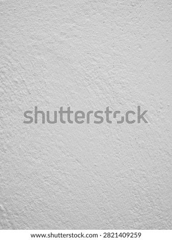 Vertical off white roughcast plaster wall texture with fine irregular surface