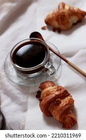 Vertical Overhead Shot Of Croissants And A Cup Black Coffee For A Simple French Breakfast