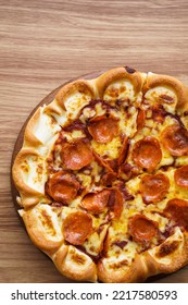 Vertical And Part Of Cheese Pizza On Wood Tray And Backdrop, View From Above, Top View