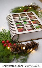 A Vertical Photo Of Advent Calendar Gift Box With Christmas Cookies