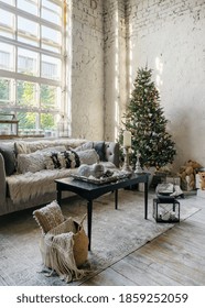 Vertical Photo Of Cozy Living Room With Soft Cushions On Comfortable Couch And New Year Decoration At Christmas Tree. Modern Apartment With Loft Interior Design