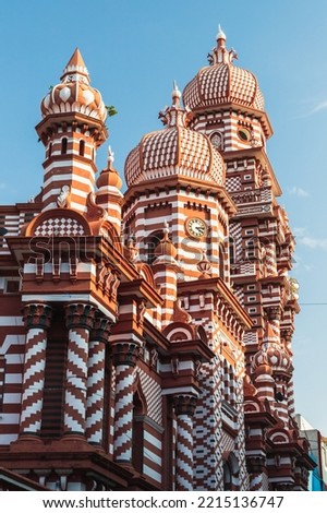 Vertical photo with exterior of the Jami Ul-Alfar Mosque, known as the Samman Kottu Palli, Rathu Palliya, Red Masjid or the Red Mosque. It is a historic mosque in Colombo, Sri Lanka