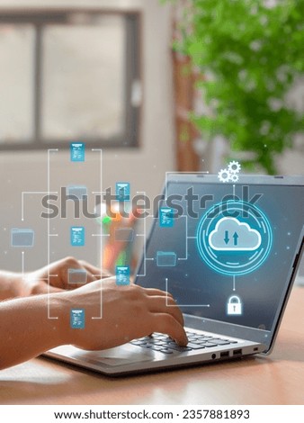 Vertical Photo of A man utilizes cloud computing technology on his laptop for data transmission, storage, backup, and retrieval