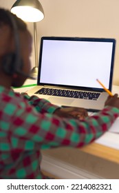 Vertical Picture Of African American Boy Learning, Using Laptop With Copy Space At Home. Home Education, Distance Learning.