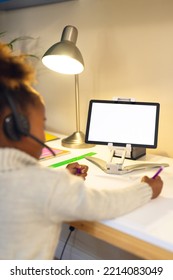 Vertical Picture Of Happy African American Girl Learning, Using Tablet With Copy Space At Home. Home Education, Distance Learning.