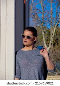 A Vertical Picture Of A Young Spanish Woman In An Urban Fashion Shoot