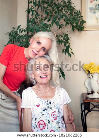 Similar – Female caretaker posing with elderly patient