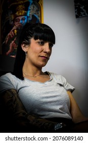 Vertical Portrait Of A Female Tattoo Artist In Her Studio