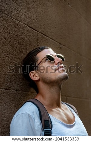 Similar – black haired man posing with sunglasses