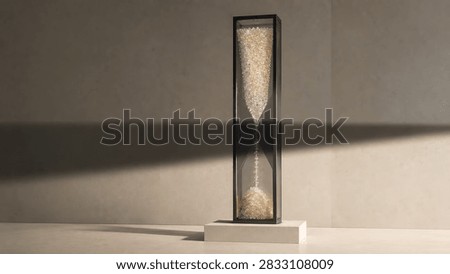 Vertical rectangular frame containing sparkling golden sand particles displayed on a concrete pedestal with hourglass shape hourglass particles pedestal concrete sculpture metallic luxurious