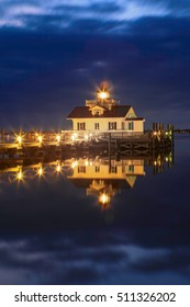 Vertical Roanoke Marshes Screw-pile Lighthouse On Shallowbag Bay In Manteo, North Carolina In The Outer Banks Illuminated At Night.