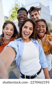 Vertical selfie young excited friends looking at camera happy. Smiling Group of people having fun together outdoors. Crazy community of college students. Modern lifestyle of multicultural people. - Shutterstock ID 2270462195