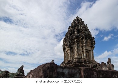 A Vertical Shot Of Angkor Wat Temple Against Blue Cloudy Sky In Angkor Archaeological Park, Krong Siem Reap, Cambodia