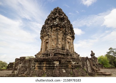 A Vertical Shot Of Angkor Wat Temple Against Blue Cloudy Sky In Angkor Archaeological Park, Krong Siem Reap, Cambodia