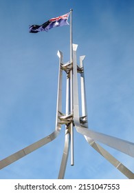 A Vertical Shot Of The Australian Flag On Top Of Parliament In Canberra