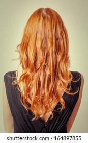 Vertical Shot Of Back View Of Red Curly Long Hair Of Beautiful Woman