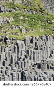 A vertical shot of basalt columns during daytime in Iceland